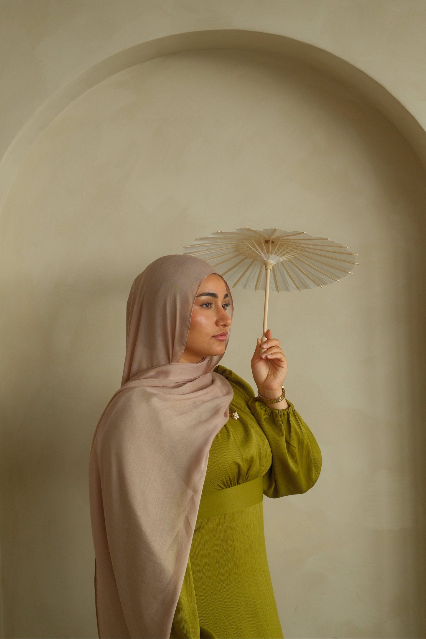 Hijabi women wearing pink modal hijab from the brand malika the collection