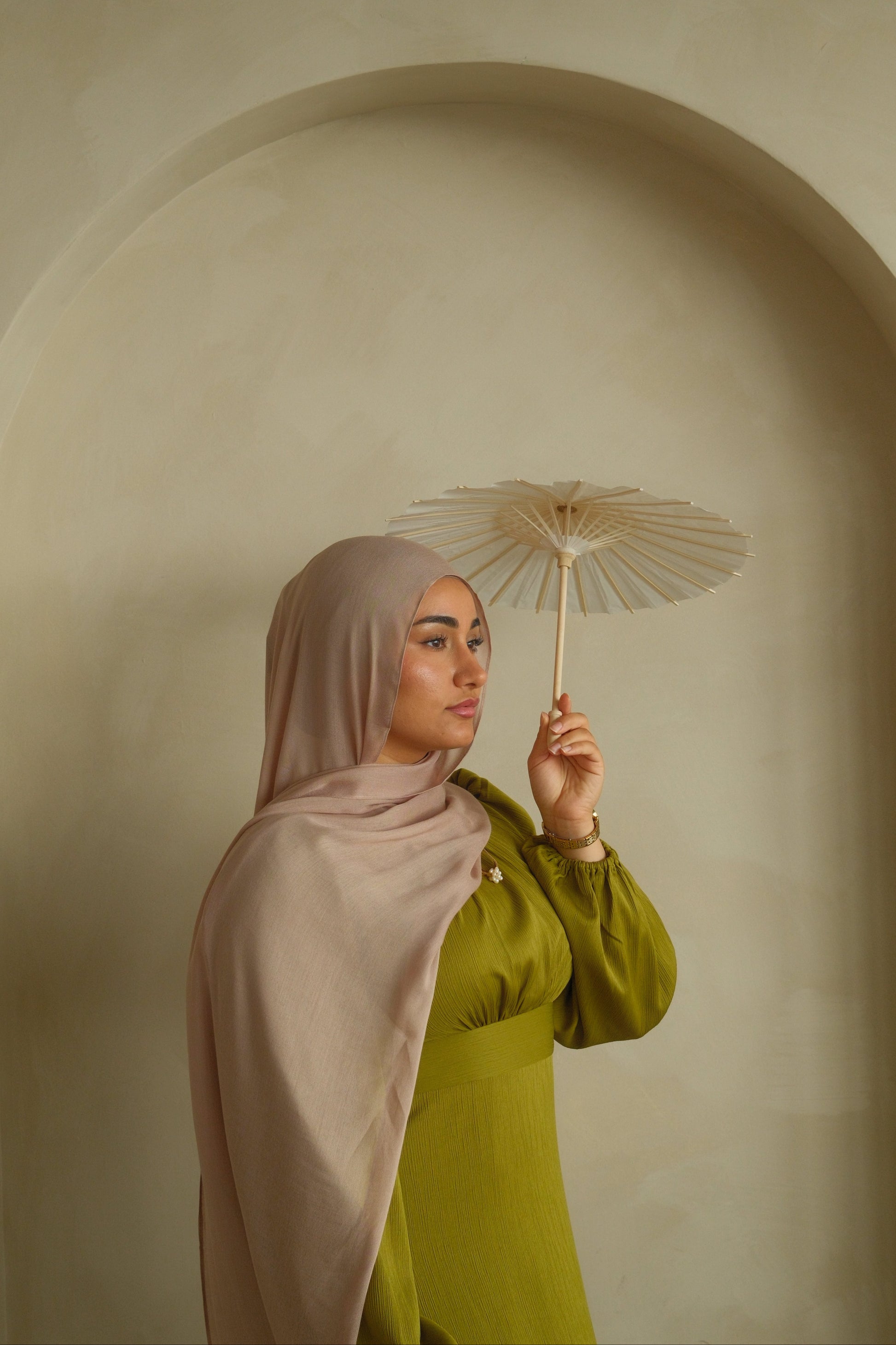 Hijabi women wearing pink modal hijab from the brand malika the collection