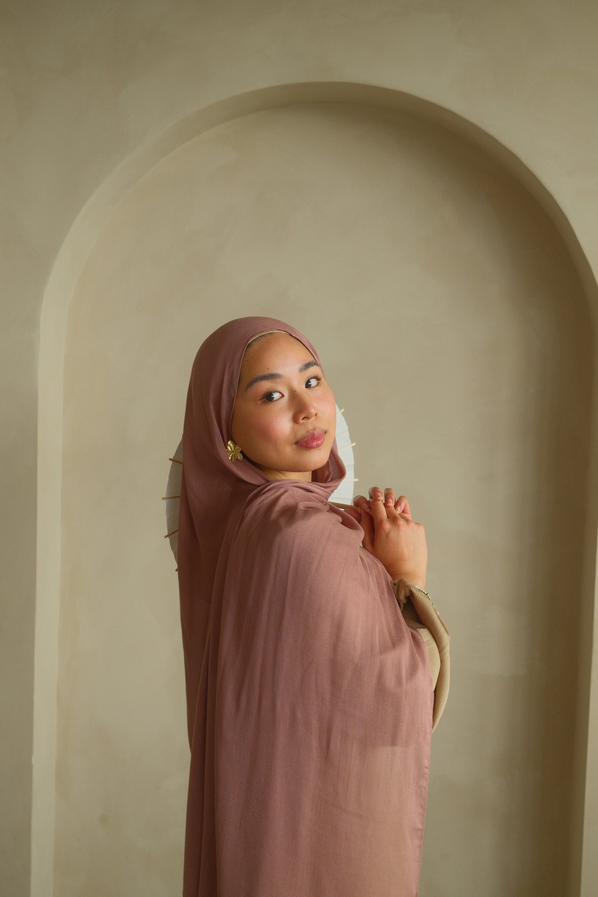 Women wearing modal hijab from malika the collection in the color dusty pink