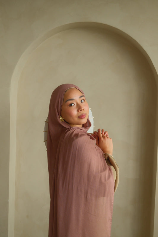 Women wearing modal hijab from malika the collection in the color dusty pink
