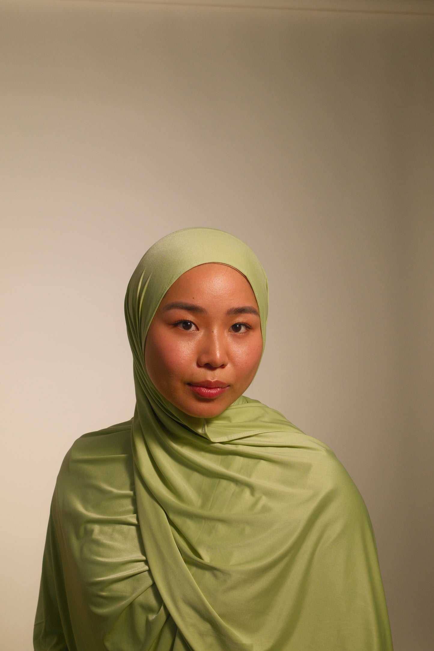 Hijabi women wearing premium liquid fluid jersey by the brand malika the collection