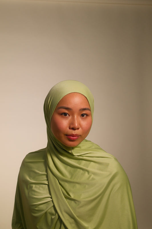 Hijabi women wearing premium liquid fluid jersey by the brand malika the collection