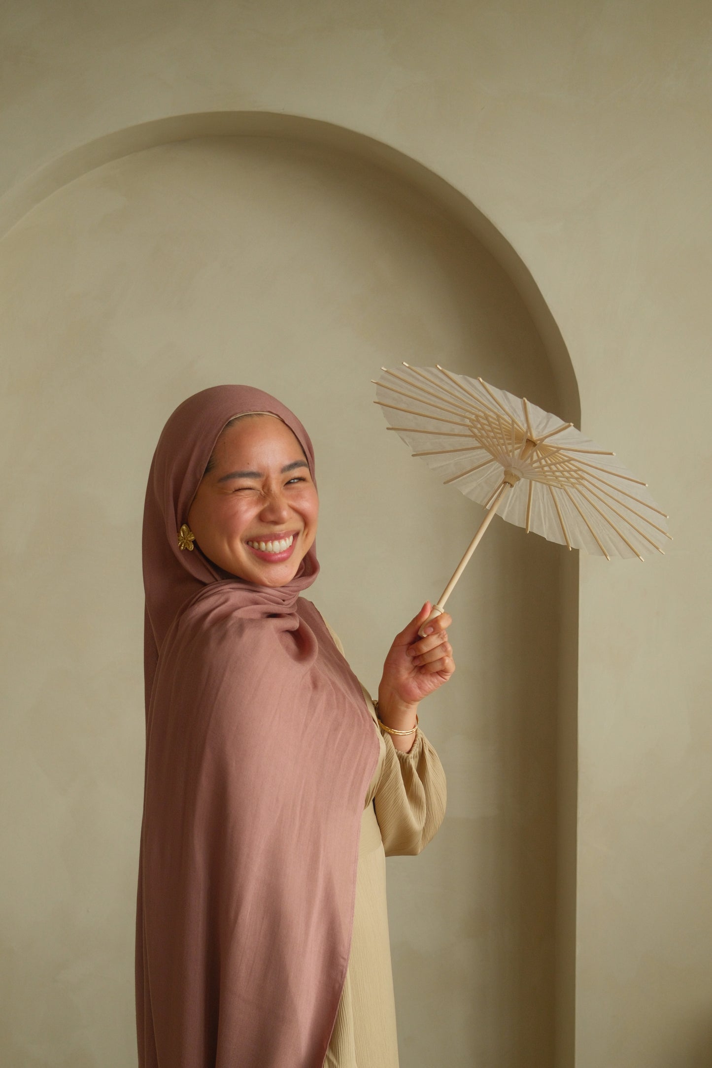 Hijabi women wearing premium modal hijab from malika the collection in the color dusty pink